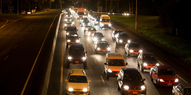 Traffic banked up on the Southern Motorway after a van crashed into a lamppost, killing the driver. Photo / Greg Bowker