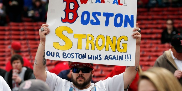 A fan holds a 'Boston Strong' sign before a baseball game between the Boston Red Sox and the Kansas City Royals in Boston. Photo / AP