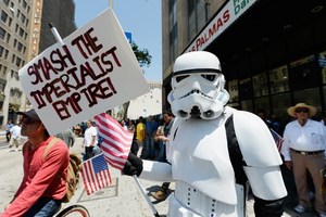 A demonstrator wearing a Star Wars storm trooper uniform participates with thousands of people in May Day march and rally in Los Angeles, Photo / AP