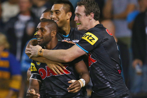 James Segeyaro of the Panthers is congratulated by his team mates after scoring. Photo /Getty Images