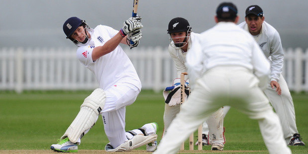 England batsman Joe Root hits out during day two of the tour match between England Lions and New Zealand. Photo / Getty Images