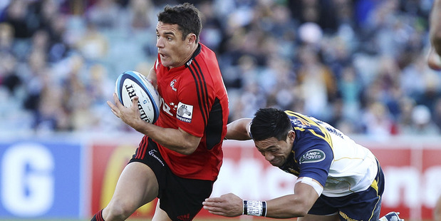 Dan Carter of the Crusaders is tackled during the round 12 Super Rugby match between the Brumbies and the Crusaders. Photo / Getty Images.