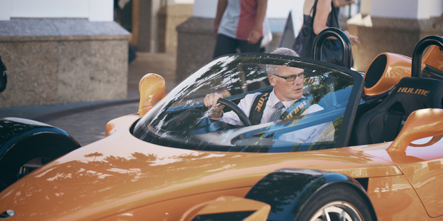 Massey vice-chancellor Steve Maharey in the Hulme Supercar that featured in an advertisement for the university. Photo / Supplied