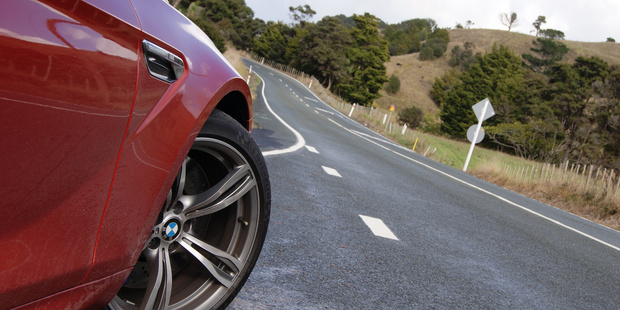The BMW crouches, ready to head north towards Helensville. Photo / David Linklater