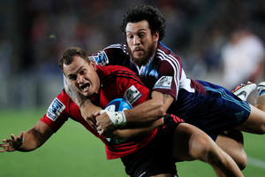 Crusaders Israel Dagg is tackled by the Blues Rene Ranger. Photo / Richard Robinson