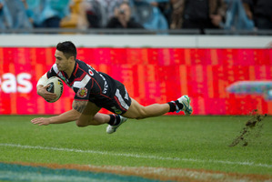 Shaun Johnson scores for the Warriors. Photo / Brett Phibbs