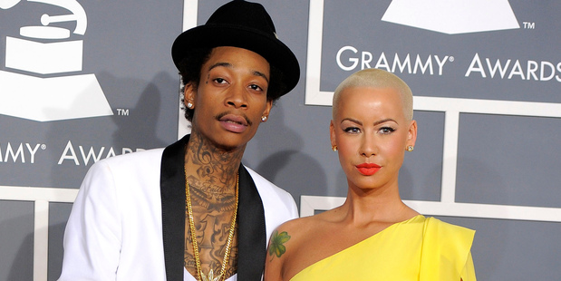 Wiz Khalifa, left, and his fiancee Amber Rose. Photo / AP