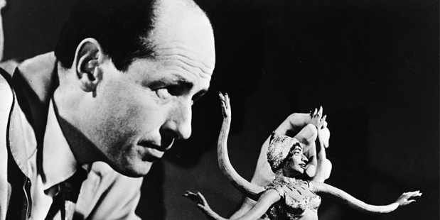 Ray Harryhausen manipulates a figure of a serpent-like monster for stop motion animation, circa 1965. Photo/AP