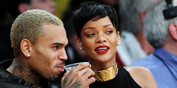 Chris Brown and Rihanna at a Los Angeles Lakers game. Photo/AP
