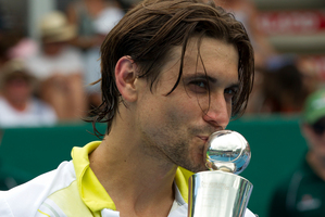 David Ferrer of Spain, with the trophy after winning against Phillipp Kohlschreiber from Germany. Photo / Brett Phibbs
