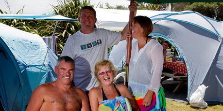 Holidaymakers Jos and Frances Hendrickx (rear), who have been camping every summer for 27 years and prefer DoC sites, with Paul and Ingrid Heynen at Wenderholm, just north of metropolitan Auckland. Photo / Sarah Ivey