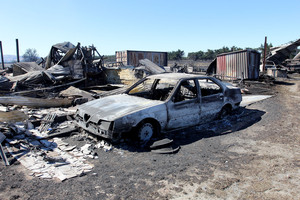 The burnt out remains of the David and Deanea Hartley property near Prebbleton. Photo / Martin Hunter