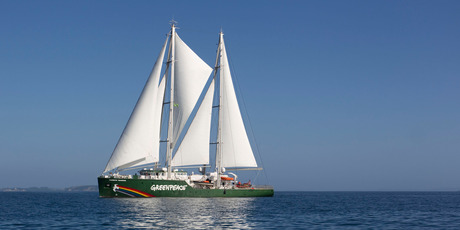 The new Rainbow Warrior sails into Matauri Bay in Northland, where the original Rainbow Warrior, bombed by French secret agents in Auckland, rests on the seabed. Photo / Greenpeace, Nigel Marple