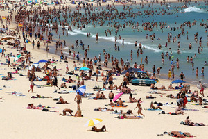 People flock to Bondi Beach to cool off in Sydney, Australia. Record temperatures were reached as high as 43 degrees around Sydney. Photo / Getty Images