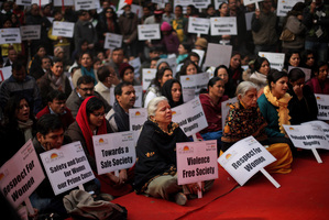 Indians sing devotional songs during a gathering to mourn the death of a 23-year old rape victim in New Delhi, India. Photo / AP