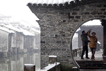A couple dance in the snow in Tongxiang in Zhejiang province. A government clampdown on dissenting views leaves little hope for a Chinese people-power renaissance. Photo / AP 