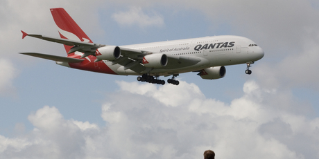 Qantas' Airbus A380, watched by spectators at the Puhinui lookout, comes in to land at Auckland Airport after a scenic flight around the upper North Island. Photo / Paul Estcourt