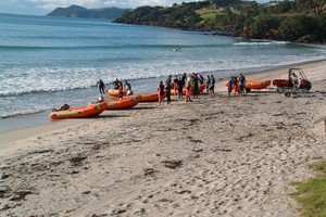 Lifeguards get ready to launch the IRBs Waipu Cove Surf Lifesaving Club training session. Photo / Northern Advocate