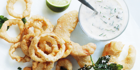 Beer-battered prawns and onion rings with lime tartare sauce. Photo / Donna Hay Magazine