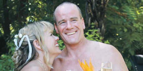 Wendy and Nick Lowe pictured during their wedding at the weekend where the naturist bride and groom, and many of the guests, attended the ceremony naked.