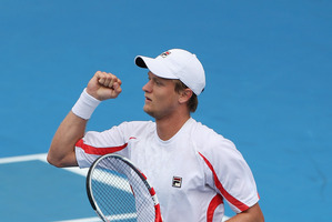 Greg Jones of Australia celebrates his first round match win against Jurgen Melzer of Austria during day two of the Heineken Open. Photo / Getty Images