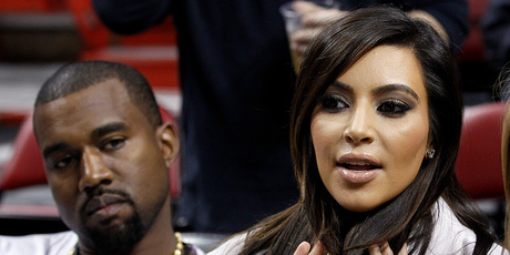 Kim Kardashian and Kanye West at a Miami Heat game. Photo/AP
