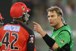 Shane Warne of the Melbourne Stars has a heated exchange with Marlon Samuels. Photo / Getty Images