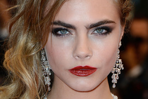 Model Cara Delevingne walked the Cannes red carpet in Chopard gems.Photo / AFP