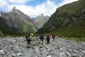 Trampers on Milford Track get their first view of MacKinnon Pass. Photo / DOC