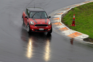 The Paceman's handling is up to Mini's legendary standard, even in serious dampness, but the handbrake lever is a tad Goosey. Photo / Supplied