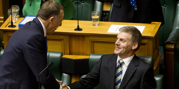 Finance Minister Bill English is congratulated Prime Minister John Key and his government colleagues after reading his fifth Budget. Photo / NZ Herald