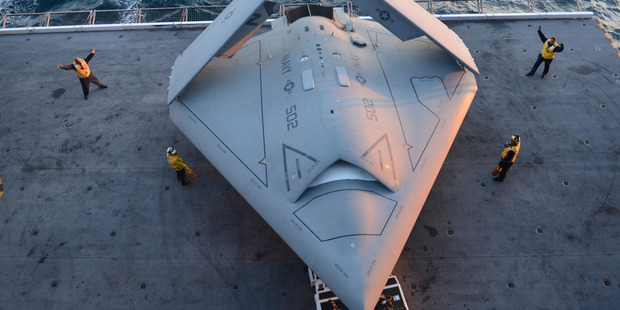 A US Navy X-47B drone is prepared for launch for the first time off the nuclear-powered aircraft carrier USS George H.W. Bush, off the coast of Virginia, yesterday. Photo / AP