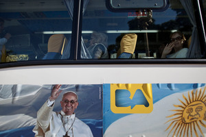 The papal bus tour of Buenos Aires rolls past 24 sites linked to the new pope but stops only twice. Picture / AP