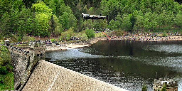 The Royal Air Force's Memorial Flight Lancaster Bomber sweeps low over the Derwent Dam in England. Photo / AP