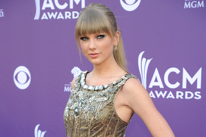 A Taylor Swift fan was arrested for swimming to her beach house. Photo / AP