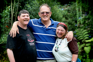 Cliff Robinson with his intellectually disabled children John and Marita, both in their 40s, whom he cares for full-time at their home in Thames. Photo / Natalie Slade