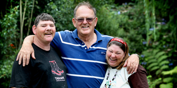 Cliff Robinson with his intellectually disabled children John and Marita, both in their 40s, whom he cares for full-time at their home in Thames. Photo / Natalie Slade