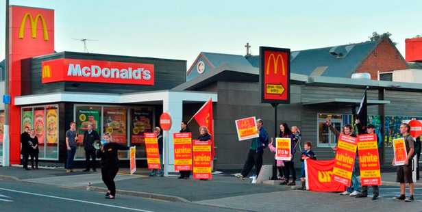 Unite Union members protest in what they called a ''McStrike'' outside the North Dunedin branch of McDonald's yesterday afternoon. Photo / Gerard O'Brien