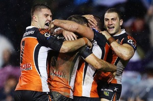 Tiger players celebrate a try in their 22-20 win over the Cowboys. Photo / Getty Images