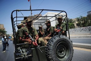 Pakistani soldiers deploy near a voting station ahead of re-polling on National assembly seat NA250 in Karachi.Photo / AFP