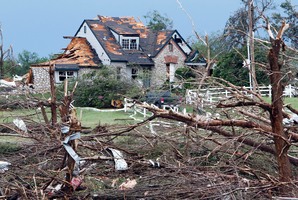 A home in Moore, Oklahoma sits severely damaged after Monday's massive tornado moved through the area. Photo / AP