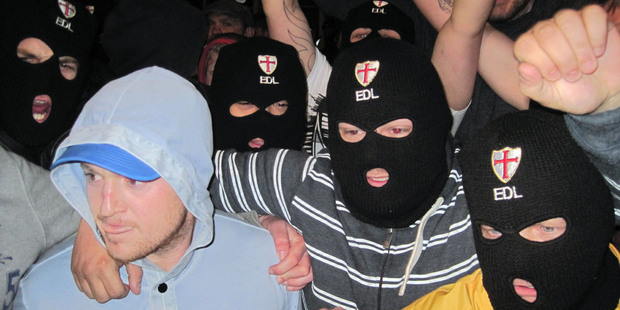 English Defence League leader Tommy Robinson, left, with supporters after the Woolwich attack. Photo / AP