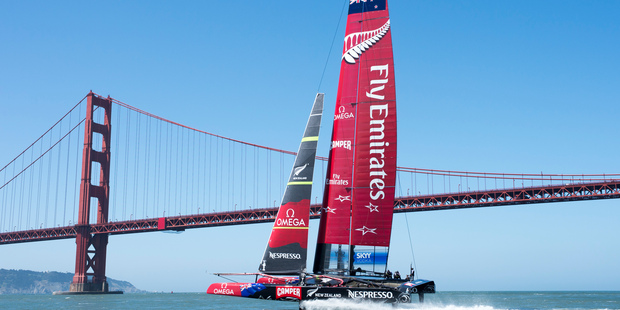 Dean Barker and his Emirates Team New Zealand crew get up to speed in their AC72 catamaran's maiden sail on San Francisco Bay yesterday. Photo / Chris Cameron