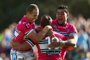 Ben Ross of the Sharks celebrates with Jeff Robson (left) and Andrew Fifita (right) of the Sharks after scoring a try during the round 10 NRL match against the Cronulla Sharks. Photo / Getty Images