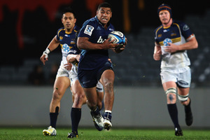 Fullback Charles Piutau provides a rare highlight for the Blues in a dismal outing against the Brumbies at Eden Park. Photo / Getty Images