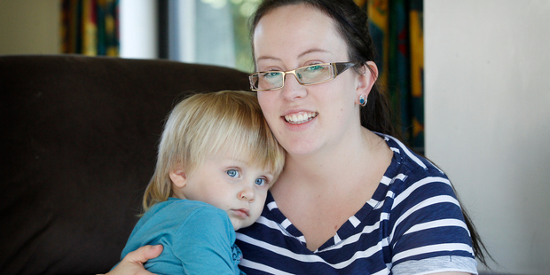 Alicia Oliver with son Kellim (20 months), who had hand foot and mouth disease, with blisters developing in places. Photo / Christine Cornege