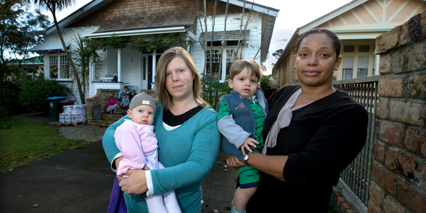 Alexandra Inkersell (left, with baby Emily) and Claude Galpin (with son Benjamin) oppose apartments in their character street. Photo / Brett Phibbs