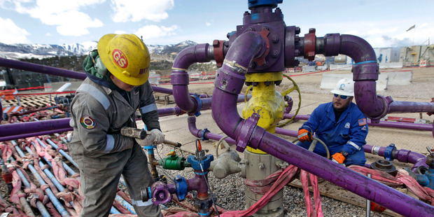 The oil scramble could be stymied by the need to control global warming. Photo / AP