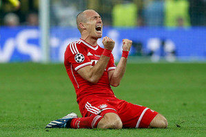 Bayern's Arjen Robben celebrates victory after the final whistle in the match against Borussia Dortmund. Photo / AP