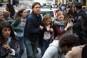 Mireille Enos with Brad Pitt and Abigail Hargrove in World War Z. Photo / Supplied